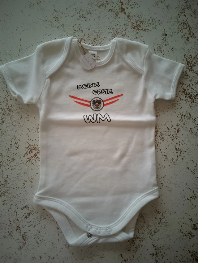 Österreich Fan-Babybody „Meine erste WM“ | KreativVeredelung